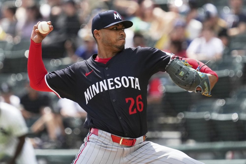 Minnesota Twins starting pitcher Taj Bradley throws against the Chicago White Sox during the first inning of a baseball game in Chicago, Sunday, Aug. 24, 2025. (AP Photo/Nam Y. Huh)
