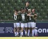 Wolfsburg's players celebrate the opening goal during the German soccer cup first round match between SV Hemelingen and VfL Wolfsburg in Bremen, Germany, Saturday, Aug 16, 2025. (Carmen Jaspersen/dpa via AP)