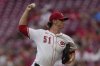 Cincinnati Reds pitcher Brady Singer throws during the first inning of a baseball game against the Philadelphia PhilliesTuesday, Aug. 12, 2025, in Cincinnati. (AP Photo/Carolyn Kaster)