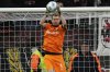 FILE - Leverkusen's goalkeeper Lukas Hradecky saves the ball during the German Bundesliga soccer match between Bayer Leverkusen and St. Pauli at the BayArena in Leverkusen, Germany, Saturday, Dec. 7, 2024. (AP Photo/Martin Meissner, File)