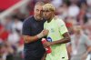 Barcelona's head coach Hansi Flick talks to Lamine Yamal during the La Liga soccer match between Mallorca and Barcelona in Mallorca, Spain, Saturday, Aug. 16, 2025. (AP Photo/Joan Mateu Parra)