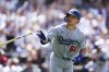 Los Angeles Dodgers' Dalton Rushing tosses his bat after hitting a three-run home run against the San Diego Padres in the seventh inning of a baseball game Sunday, Aug. 24, 2025, in San Diego. (AP Photo/Derrick Tuskan)