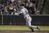 Cleveland Guardians' Steven Kwan hits an RBI infield single during the ninth inning of a baseball game against the Tampa Bay Rays, Saturday, Sept. 6, 2025, in Tampa, Fla. (AP Photo/Jason Behnken)