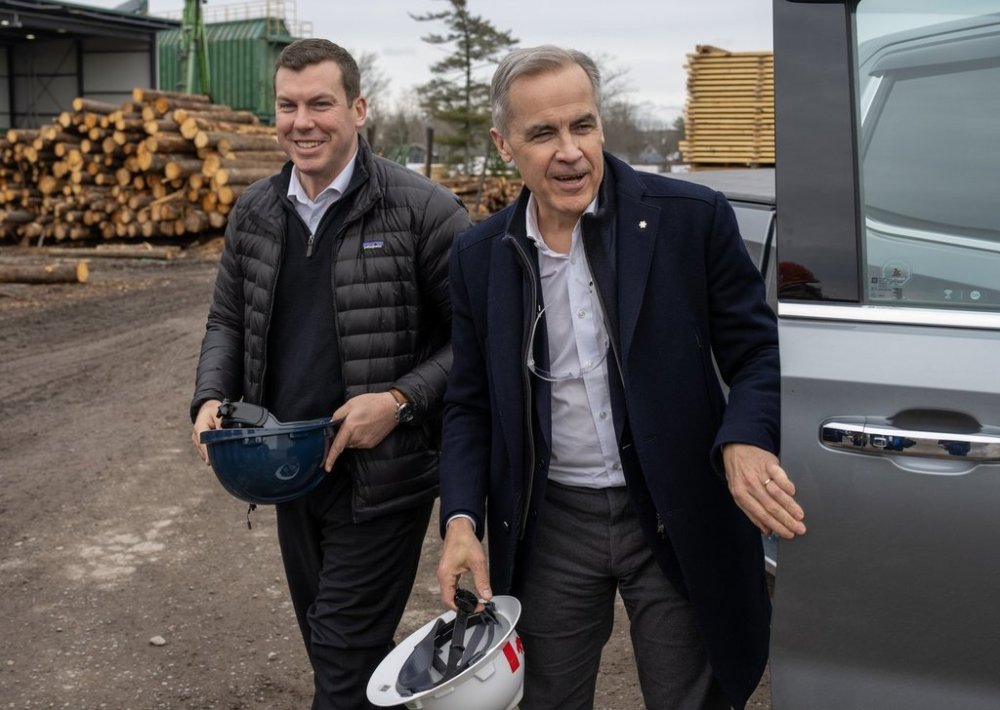 Prime Minister Mark Carney arrives at Elmsdale Lumber Yard with then-agriculture minister Kody Blois during a campaign stop in Elmsdale, N.S., on Tuesday, March 25, 2025. THE CANADIAN PRESS/Frank Gunn