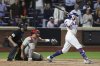 New York Mets' Brandon Nimmo hits a single leading Starling Marte to score during the ninth inning of a baseball game against the Philadelphia Phillies, Tuesday, Aug. 26, 2025, in New York. (AP Photo/Pamela Smith)