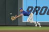 Minnesota Twins right fielder Matt Wallner tries to catch a single hit by Kansas City Royals' John Rave during the fifth inning of a baseball game Friday, Aug. 8, 2025, in Minneapolis. (AP Photo/Abbie Parr)
