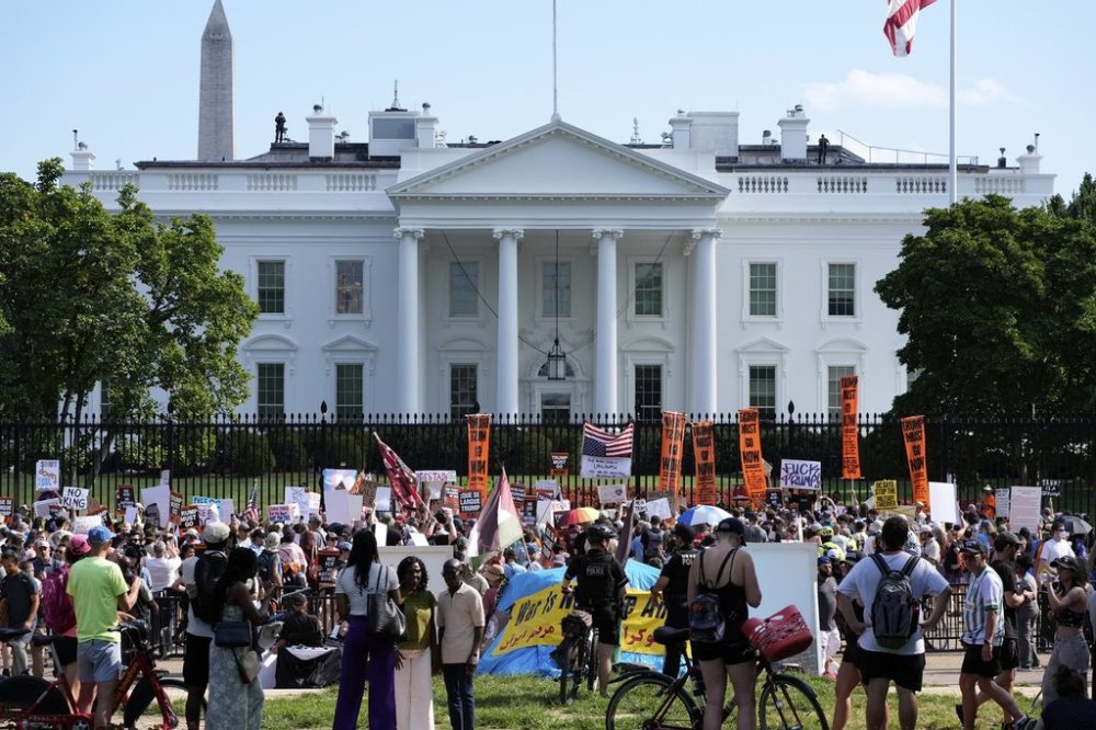 Activists protest President Donald Trump's federal takeover of policing of the District of Columbia near the White House, Saturday, Aug. 16, 2025, in Washington. (AP Photo/Alex Brandon)