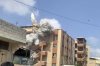 This frame grab from a video shows the second of two projectiles the Israeli army fired in quick succession at a stairwell outside Nasser Hospital, just minutes after an initial round of attacks hit the building in Khan Younis, Gaza Strip, Monday, Aug. 25, 2025. (UGC via AP)