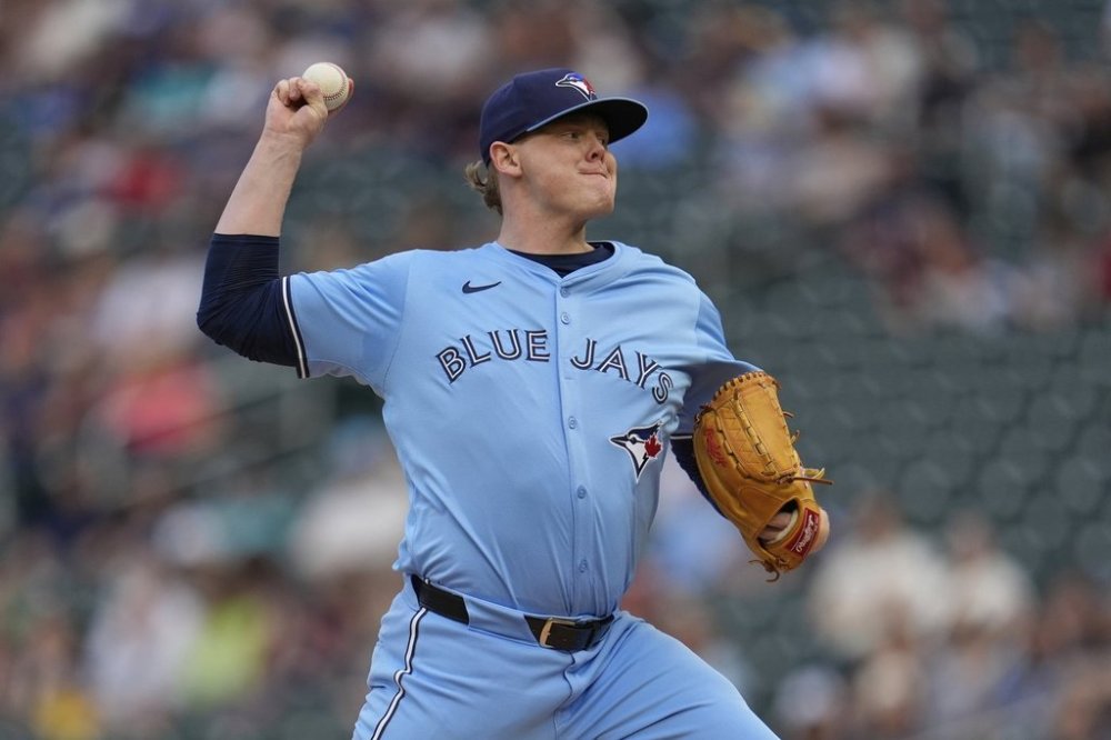 Toronto Blue Jays starting pitcher Paxton Schultz (65) delivers during the first inning of a baseball game against the Minnesota Twins, Friday, June 6, 2025, in Minneapolis. (AP Photo/Abbie Parr)