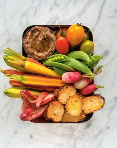 Bagel chips and black bean dip are shown in this handout photo from the book 