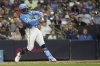 Milwaukee Brewers' William Contreras hits a two-run home run during the seventh inning of a baseball game against the New York Mets, Saturday, Aug. 9, 2025, in Milwaukee. (AP Photo/Aaron Gash)