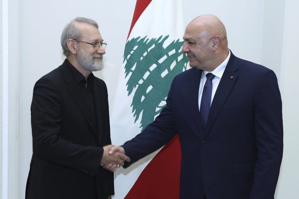In this photo, released by the Lebanese Presidency press office, Lebanese President Joseph Aoun, right, shakes hands with Iranian Secretary of Supreme National Security Council Ali Larijani, at the presidential palace in Baabda, east of Beirut, Lebanon, Wednesday, Aug. 13, 2025. (Lebanese Presidency press office via AP)