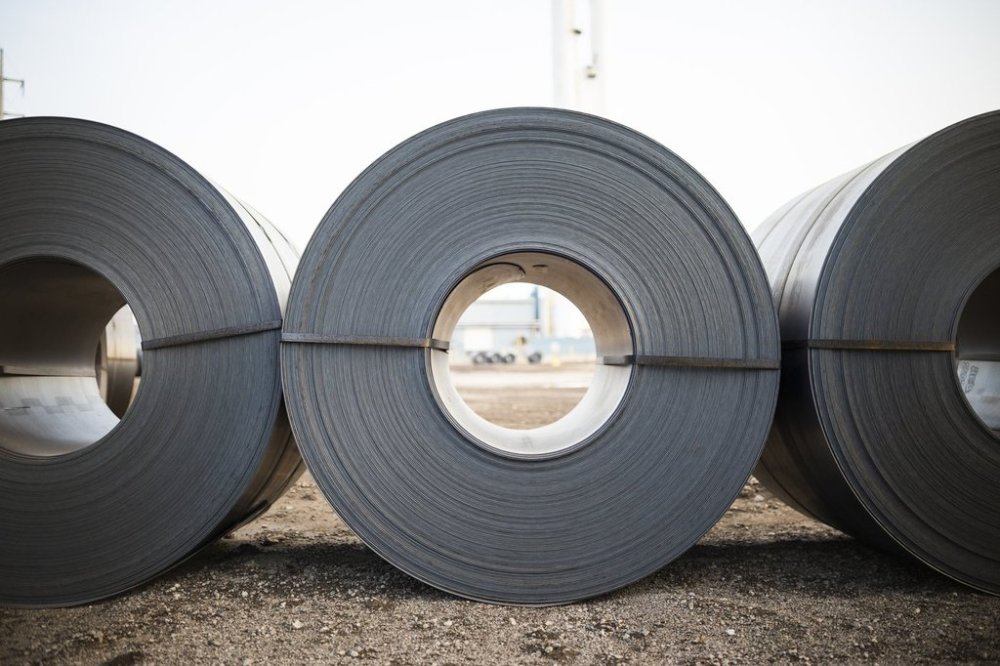 China has filed a complaint with the World Trade Organization over Canada's surtax on imports containing Chinese steel. Rolled coils of steel sit in the yard at Algoma Steel Inc., the second largest steel producer in Canada, in Sault Ste. Marie, Ont., on Friday, July 25, 2025. THE CANADIAN PRESS/Nick Iwanyshyn