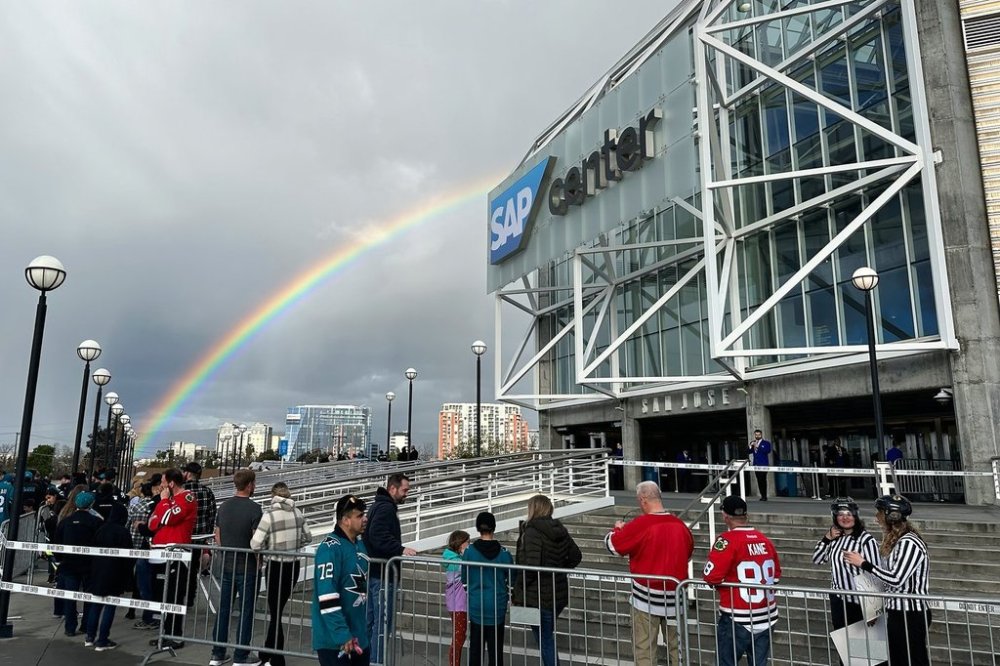 FILE — A rainbow appears as fans line up outside SAP Center at San Jose before an NHL hockey game between the Chicago Blackhawks and the San Jose Sharks in San Jose, Calif., March 23, 2024. (AP Photo/Jeff Chiu, File)