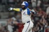 Atlanta Braves designated hitter Marcell Ozuna (20) celebrates his three-run homer against the Miami Marlins in the fifth inning in the second baseball game of a doubleheader, Saturday, Aug. 9, 2025, in Atlanta. (AP Photo/Mike Stewart)