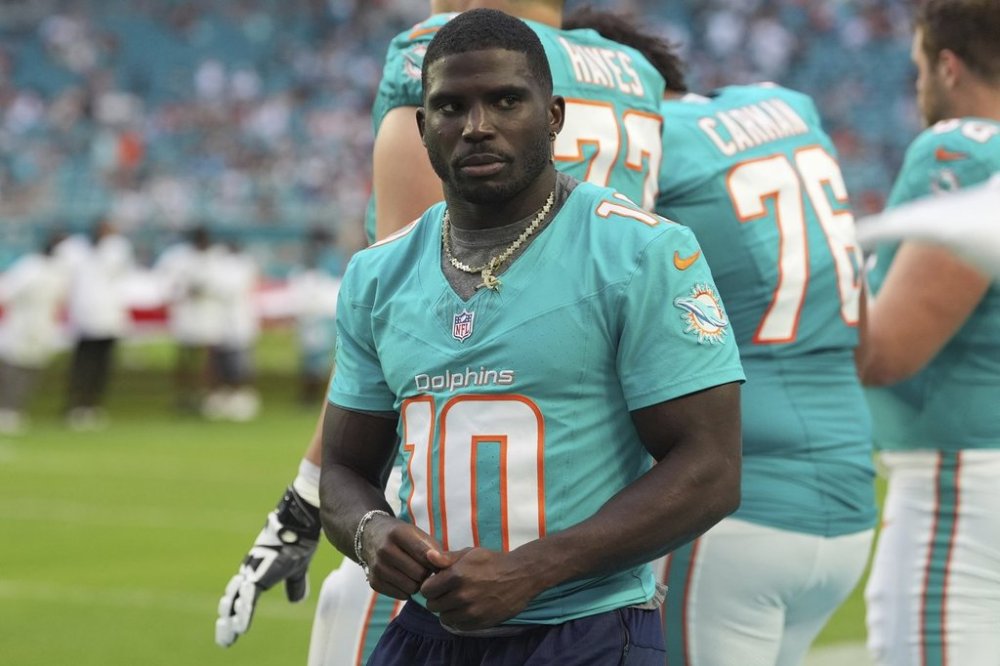 Miami Dolphins wide receiver Tyreek Hill (10) stands on the sidelines before an NFL preseason football game against the Jacksonville Jaguars, Saturday, Aug. 23, 2025, in Miami Gardens, Fla. (AP Photo/Rebecca Blackwell)
