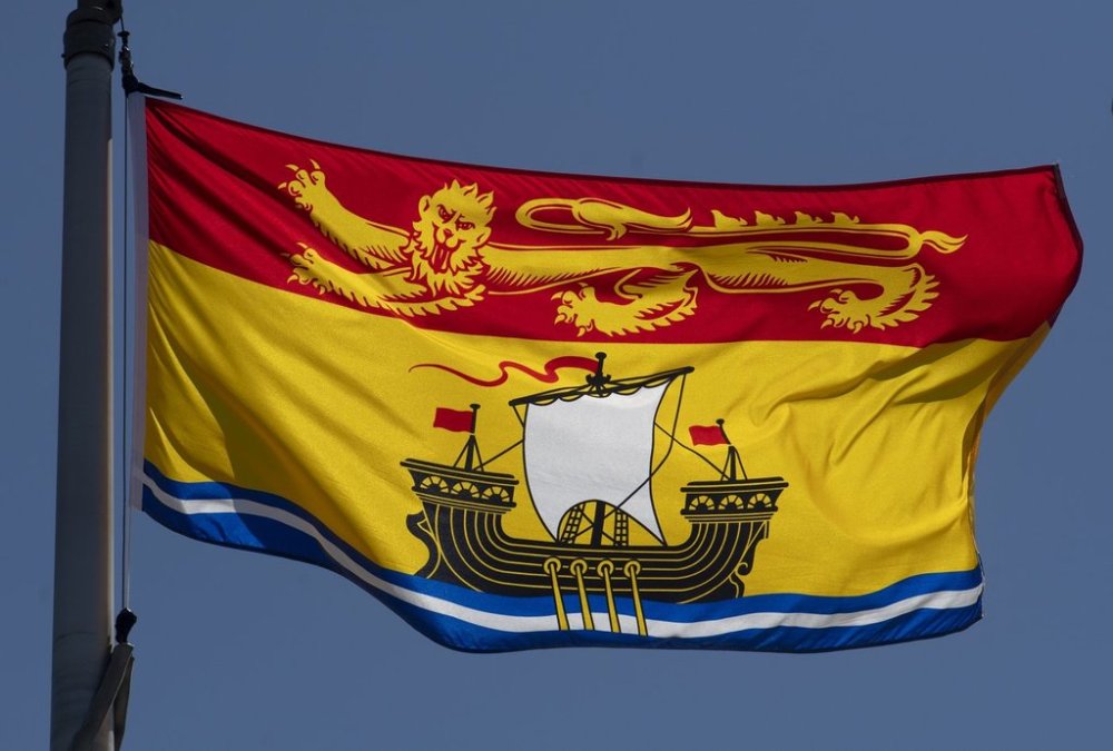 New Brunswick's provincial flag flies on a flag pole in Ottawa, Monday, July 6, 2020. THE CANADIAN PRESS/Adrian Wyld