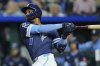 Kansas City Royals' Maikel Garcia watches his two run home home run during the third inning of a baseball game against the Minnesota Twins, Friday, Sept. 5, 2025, in Kansas City, Mo. (AP Photo/Charlie Riedel)