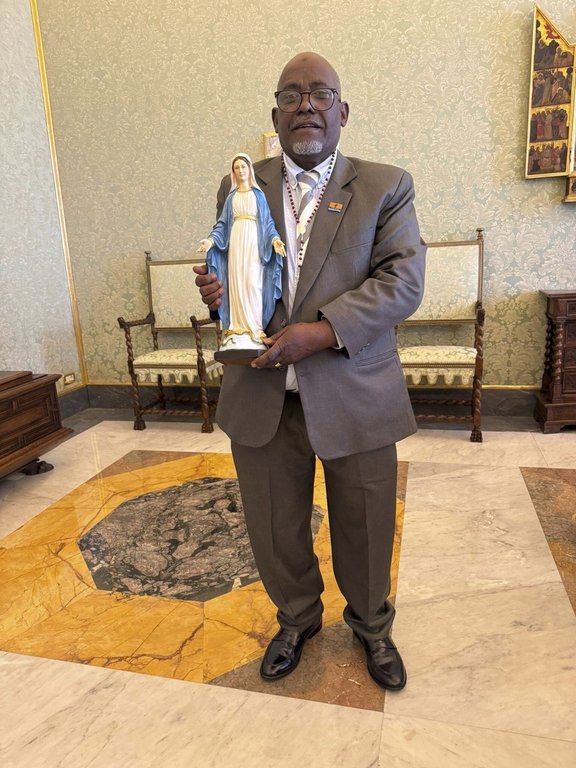 President of Chagos Refugees Group Louis Olivier Bancoult holds a statue of the Virgin at the Vatican, Saturday, Aug. 23, 2025. Mary(Philippe Sands Via AP)