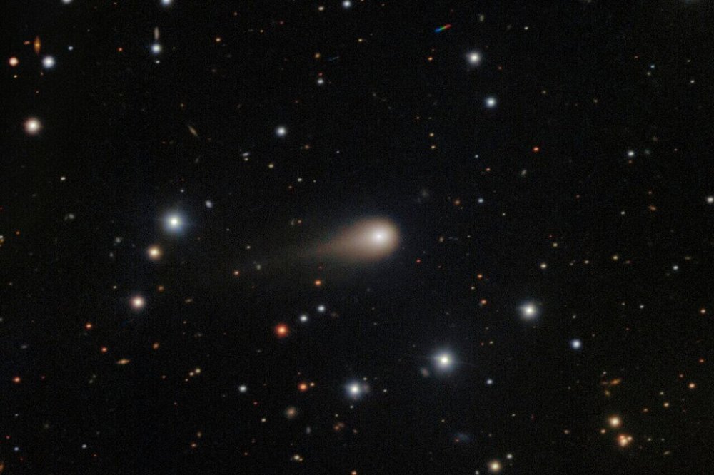 This image composed from multiple exposures and provided by NSF's NOIRLab shows a comet streaking across a star field above the International Gemini Observatory on Cerro Pachon, near La Serena, Chile. (NSF's NoirLab via AP)