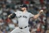 New York Yankees starting pitcher Carlos Rodon delivers against Houston Astros' Jeremy Peña during the first inning of a baseball game Thursday, Sept. 4, 2025, in Houston. (AP Photo/Karen Warren)