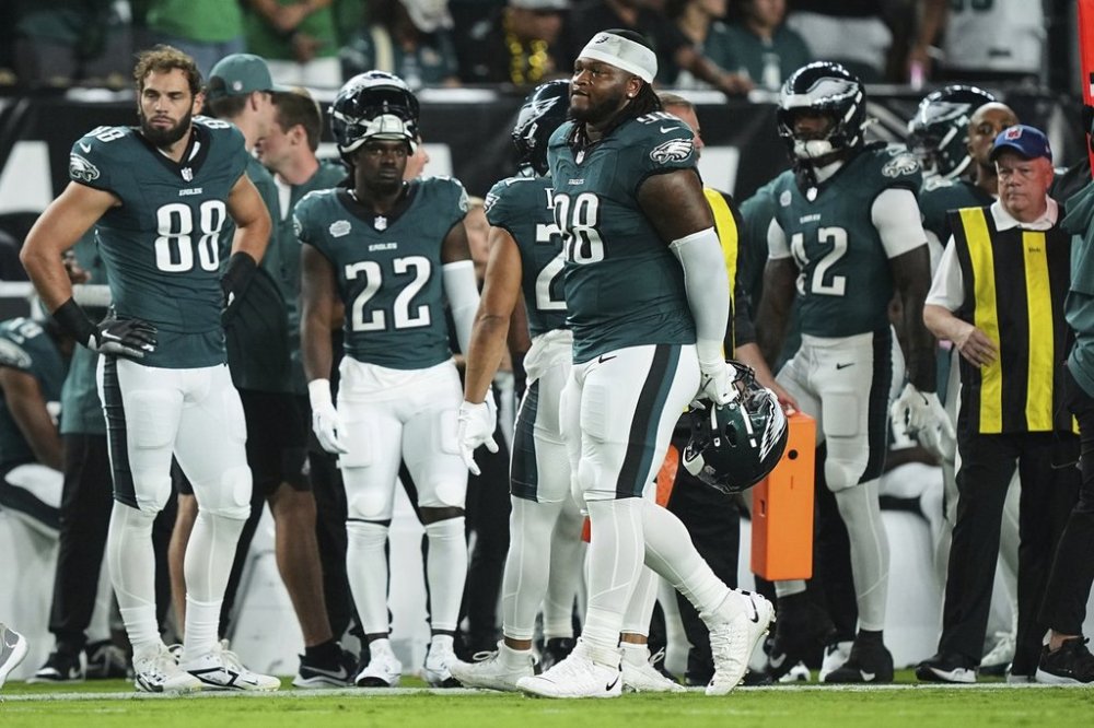 Philadelphia Eagles defensive tackle Jalen Carter (98) walks off the field after being disqualified for unsportsman like conduct before an NFL football game against the Dallas Cowboys Thursday, Sept. 4, 2025, in Philadelphia. (AP Photo/Matt Rourke)