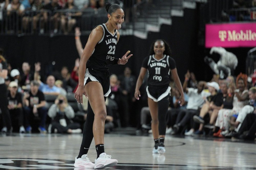 Las Vegas Aces center A'ja Wilson (22) celebrates after a play against the Minnesota Lynx during the second half of a WNBA basketball game Thursday, Sept. 4, 2025, in Las Vegas. (AP Photo/John Locher)