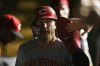 Cincinnati Reds' Jake Fraley celebrates with teammates in the dugout after scoring on a TJ Friedl single during the seventh inning of a baseball game against the Chicago Cubs, Monday, Aug. 4, 2025, in Chicago. (AP Photo/Paul Beaty)