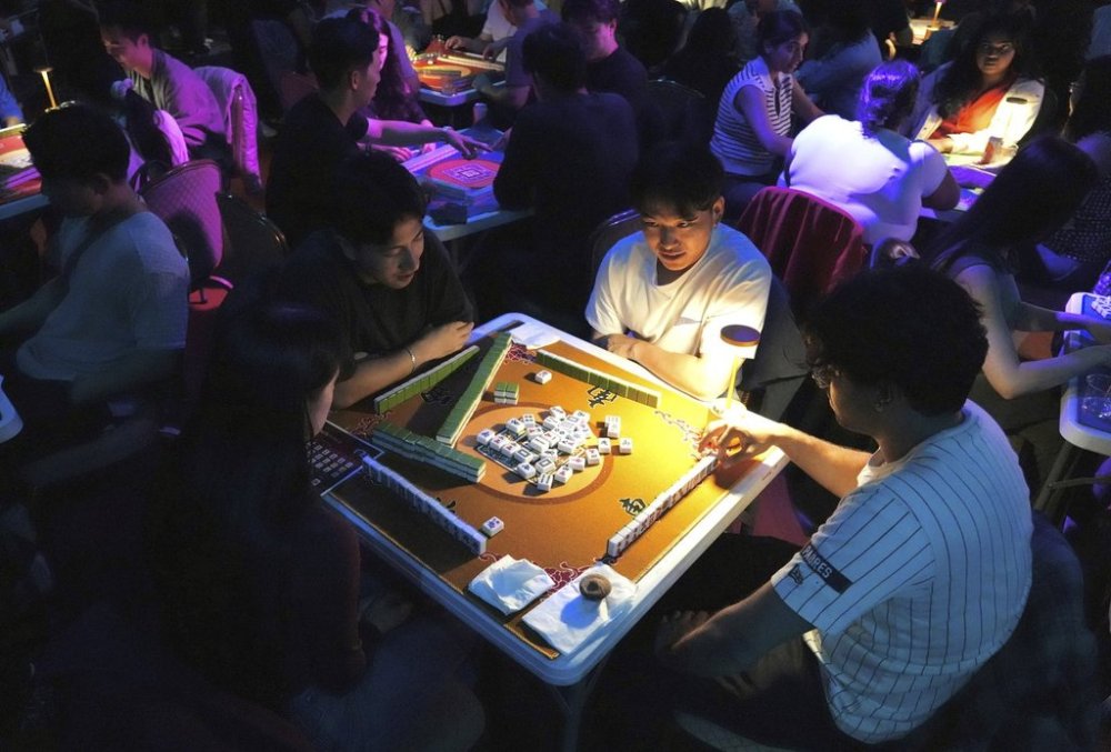 People play mahjong at an event organized by the YLL Mahjong Club on Friday, Aug. 15, 2025, in San Francisco. (AP Photo/Terry Chea)