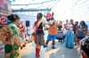 Dancing with the Folklorama Llama mascot. (Ruth Bonneville / Free Press)