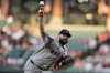 Boston Red Sox starting pitcher Lucas Giolito delivers during the second inning of a baseball game against the Baltimore Orioles, Tuesday, Aug. 26, 2025, in Baltimore. (AP Photo/Stephanie Scarbrough)