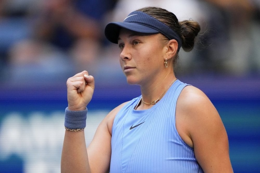 Amanda Anisimova, of the United States, reacts after scoring a point against Iga Swiatek, of Poland, during the quarterfinal round of the U.S. Open tennis championships, Wednesday, Sept. 3, 2025, in New York. (AP Photo/Yuki Iwamura)