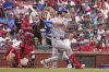Chicago Cubs' Kyle Tucker follows through on an RBI single during the first inning of a baseball game against the St. Louis Cardinals Saturday, Aug. 9, 2025, in St. Louis. (AP Photo/Jeff Roberson)