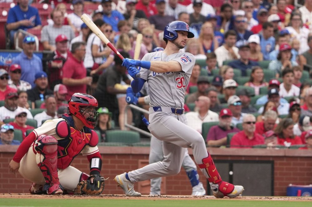 Chicago Cubs' Kyle Tucker follows through on an RBI single during the first inning of a baseball game against the St. Louis Cardinals Saturday, Aug. 9, 2025, in St. Louis. (AP Photo/Jeff Roberson)