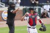 Home plate umpire Jen Pawol calls a strike during the first inning of a baseball game between the Miami Marlins and Atlanta Braves, Sunday, Aug. 10, 2025, in Atlanta. (AP Photo/Colin Hubbard)