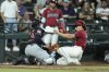 Cleveland Guardians catcher Bo Naylor, left, tags out Arizona Diamondbacks' Alek Thomas trying to score during the fifth inning of a baseball game Wednesday, Aug. 20, 2025, in Phoenix. (AP Photo/Ross D. Franklin)