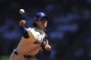 Seattle Mariners starting pitcher Bryan Woo throws against the Tampa Bay Rays during the first inning of a baseball game Sunday, Aug. 10, 2025, in Seattle. (AP Photo/Lindsey Wasson)