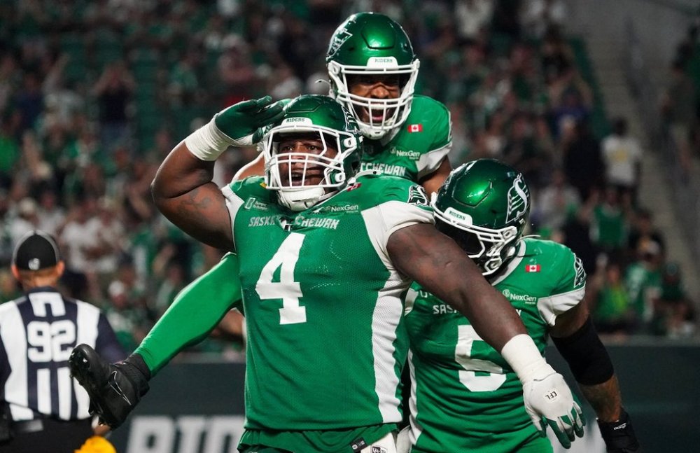 Saskatchewan Roughriders defensive lineman Micah Johnson (4) celebrates with teammates during the second half of CFL football action in Regina, on Friday, July 25, 2025. THE CANADIAN PRESS/Heywood Yu