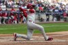 Philadelphia Phillies' Bryson Stott hits an RBI double during the ninth inning of a baseball game against the Milwaukee Brewers Thursday, Sept. 4, 2025, in Milwaukee. (AP Photo/Morry Gash)
