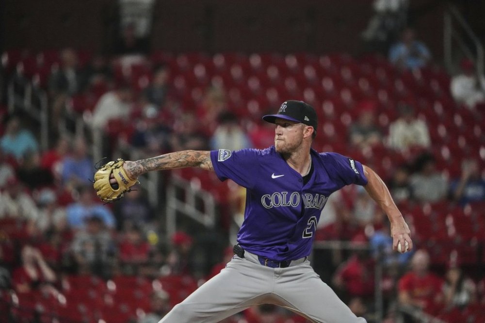 Colorado Rockies starting pitcher Kyle Freeland throws during the seventh inning of a baseball game against the St. Louis Cardinals Tuesday, Aug. 12, 2025, in St. Louis. (AP Photo/Jeff Roberson)