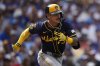 Milwaukee Brewers' Joey Ortiz runs to first after hitting a one-run single during the eighth inning of the first baseball game of a split doubleheader against the Chicago Cubs, Monday, Aug. 18, 2025, in Chicago. (AP Photo/Erin Hooley)