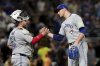 Toronto Blue Jays pitcher Jeff Hoffman, right, celebrates with catcher Alejandro Kirk, left, after getting the final out of a baseball game against the Pittsburgh Pirates Tuesday, Aug. 19, 2025, in Pittsburgh. (AP Photo/Matt Freed)