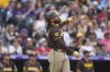 San Diego Padres' Fernando Tatis Jr. tosses his bat after hitting a three-run home run off Colorado Rockies starting pitcher McCade Brown in the second inning of a baseball game Saturday, Sept. 6, 2025, in Denver. (AP Photo/David Zalubowski)