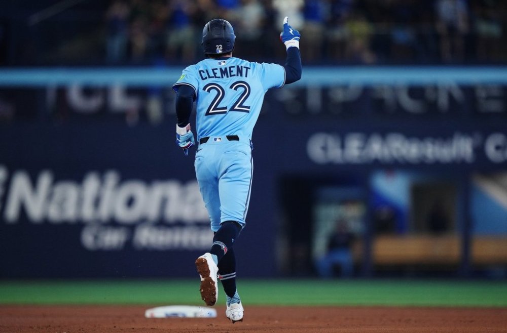 Blue Jays third baseman Ernie Clement celebrates his three-run homer against the Chicago Cubs during the fourth inning of a Major League Baseball game in Toronto on Tuesday, Aug. 12, 2025. THE CANADIAN PRESS/Nathan Denette