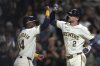 Milwaukee Brewers' Brice Turang (2) celebrates a two-run home run with Andruw Monasterio (14) during the sixth inning of a baseball game against the Arizona Diamondbacks, Tuesday, Aug. 26, 2025, in Milwaukee. (AP Photo/Kayla Wolf)