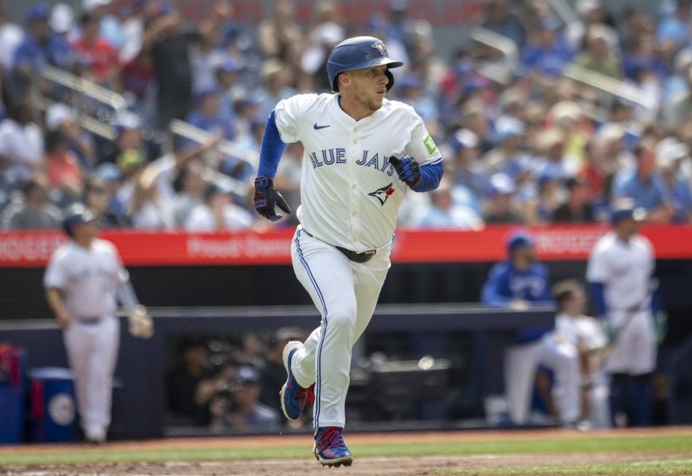 Toronto Blue Jays' Myles Straw (3) hits a home run against the Texas Rangers during the second inning of MLB baseball in Toronto, Saturday, Aug. 16, 2025. THE CANADIAN PRESS/Tara Walton