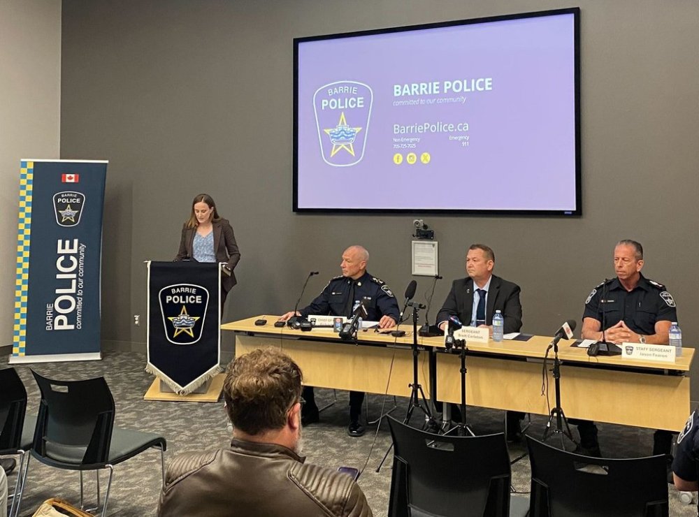 Barrie Police Service communications supervisor Jennett Mays, left to right, police Chief Rich Johnston, Sgt. Brett Carleton and Staff Sgt. Jason Fearon provide an update on a homicide case in Barrie, Ont., on Tuesday, Aug. 26, 2025. THE CANADIAN PRESS/Vanessa Tiberio