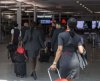 Air Canada flight attendants walk through the Montreal-Pierre Elliott Trudeau International Airport in Dorval, Que., Friday, Aug. 15, 2025. THE CANADIAN PRESS/Christinne Muschi