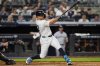 New York Yankees' Giancarlo Stanton (27) hits a home run during the fifth inning of a baseball game against the Minnesota Twins, Tuesday, Aug. 12, 2025, in New York. (AP Photo/Yuki Iwamura)