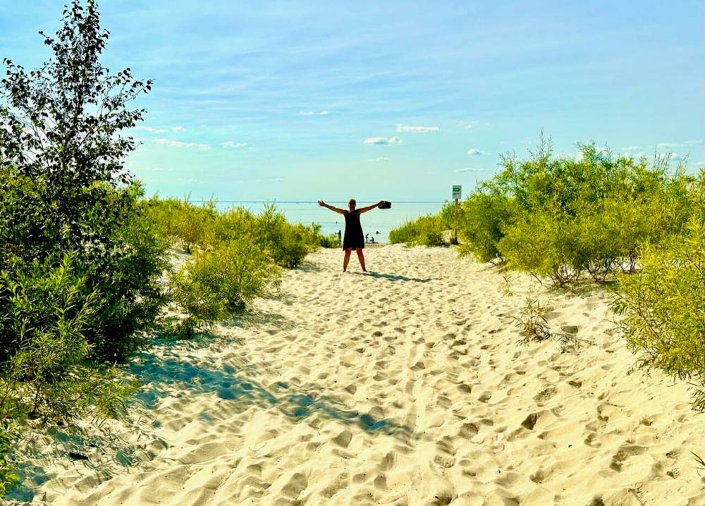 photos by Gord Mackintosh
Margie Mackintosh rejoices at Grand Beach’s quieter East Beach at Lake Winnipeg.